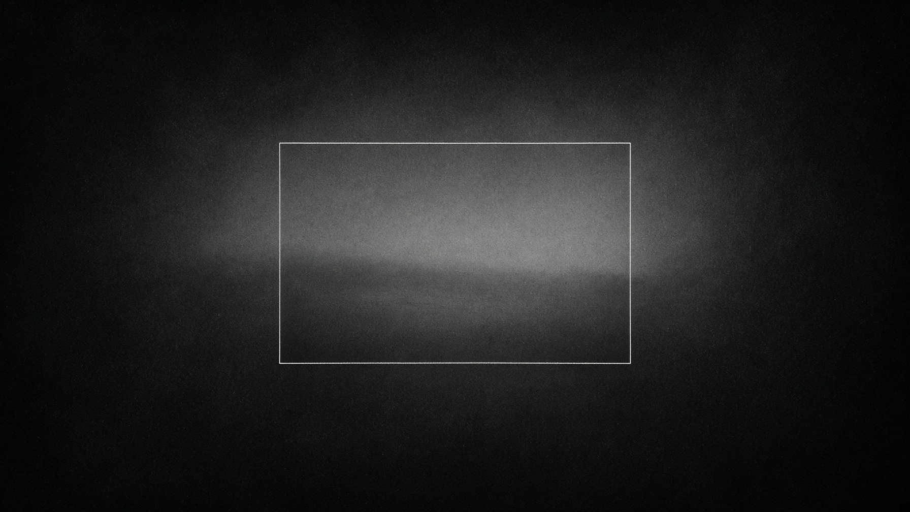 Rettangolo su sfondo nero e luce soffusa